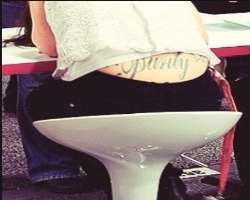 McGrath is a tattoo lover. Also, she had one on her back saying 'Purity.'